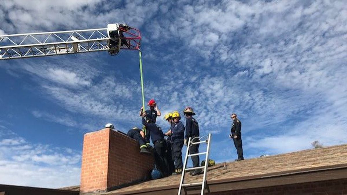 Firefighters had to pull him from above with a crane and push him from below before “up the chimney he rose.” (Source: Tucson Fire Department)