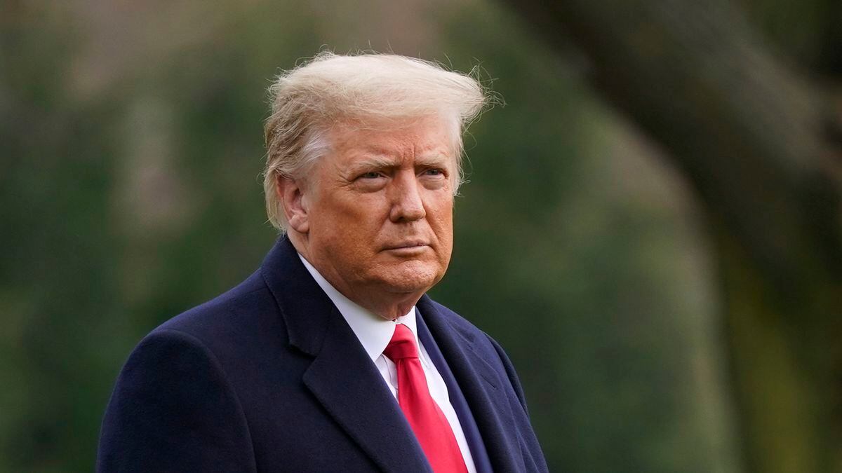 In this Dec. 12, 2020, file photo President Donald Trump walks on the South Lawn of the White...