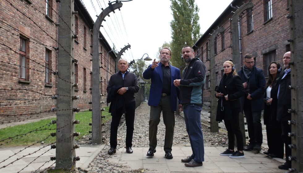 Arnold Schwarzenegger, center, and Simon Bergson, chairman of the Auschwitz Jewish Center...