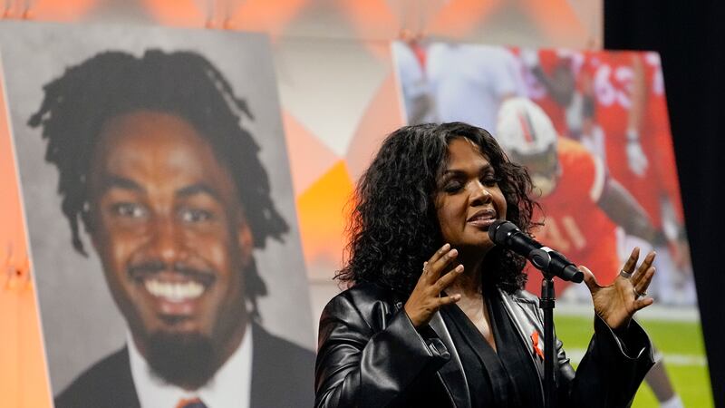 Gospel singer CeCe Winans sings during a memorial service for three slain University of...